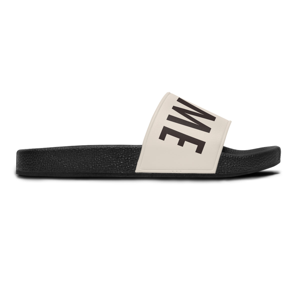 Stay Home Slides in black with a cream strap, side profile view showing part of the text