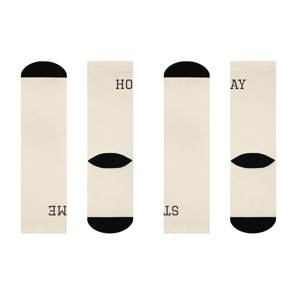 Flat lay of the Stay Home Socks pair unfolded, showing the STAY and HOME wordmark split across both socks with black heel and toe accents