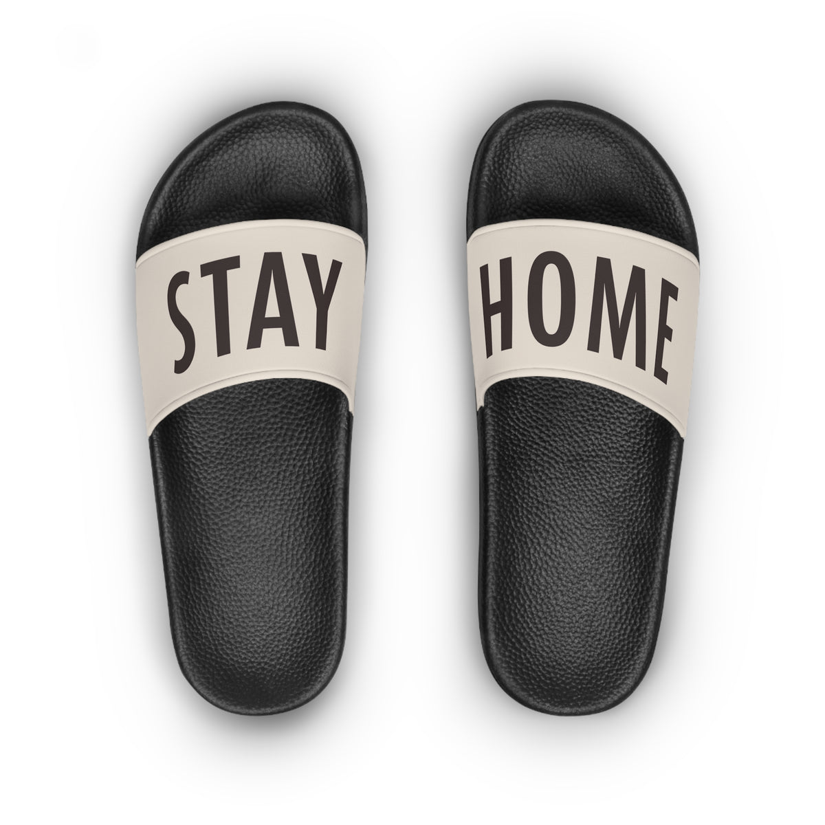 Stay Home Slides in black with a cream strap, top view of the pair showing the STAY HOME text