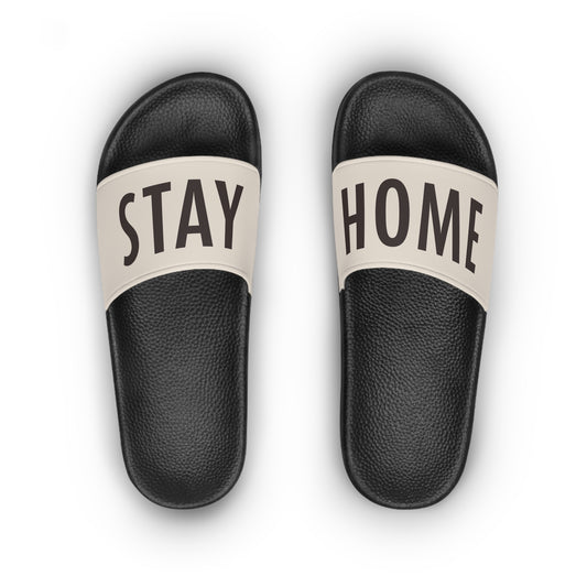 Stay Home Slides in black with a cream strap, top view of the pair showing the STAY HOME text