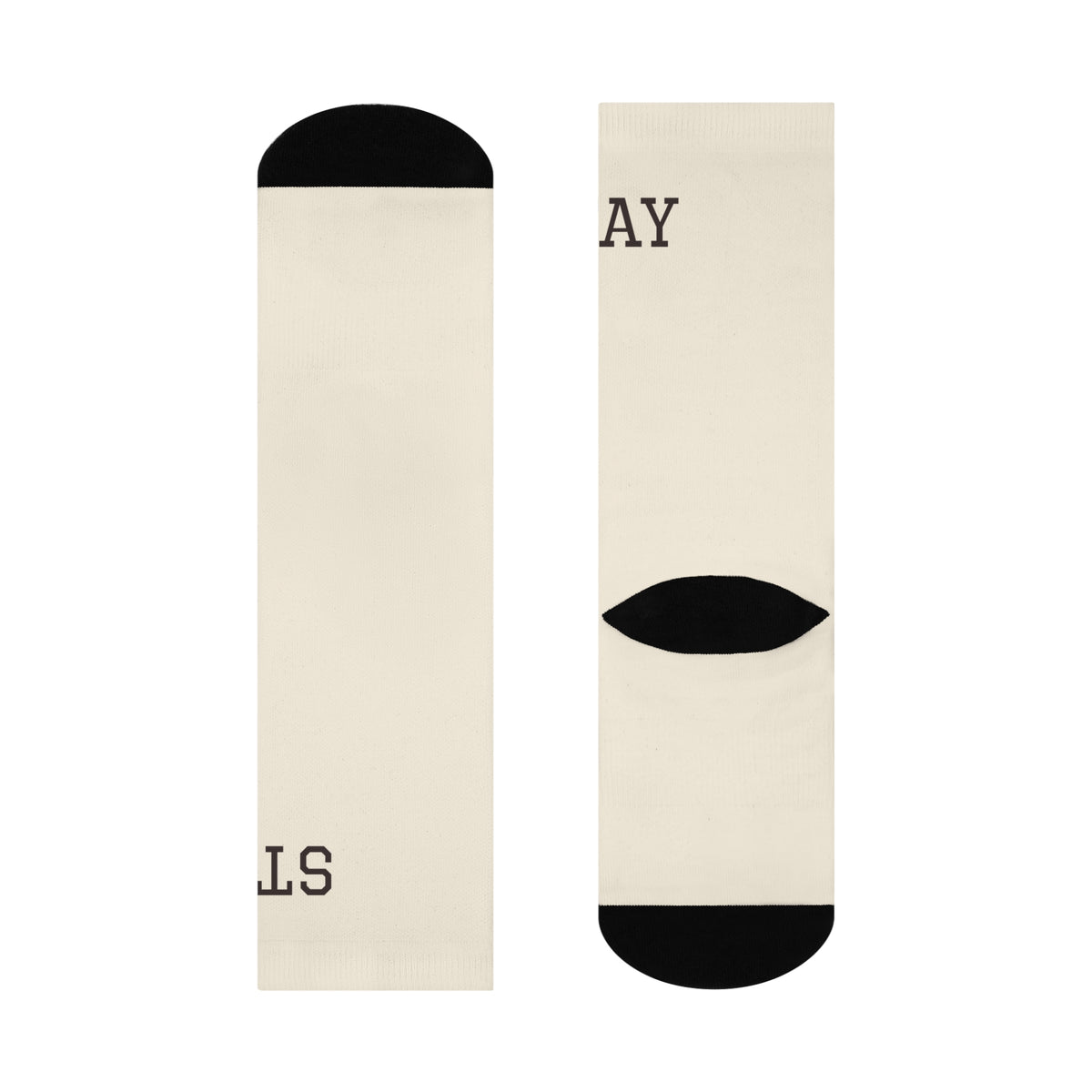 The Stay Home Socks in the Staying In Duo bundle, flat lay showing the ivory knit with black contrast heel and toe